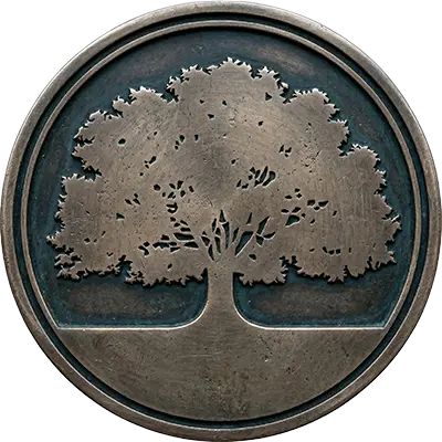 A round, metallic coin or medallion featuring a detailed, raised relief of an oak tree against a dark background.