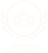 Tripadvisor Award Winner logo: a white owl icon inside a circle surrounded by laurel leaves on a black background.