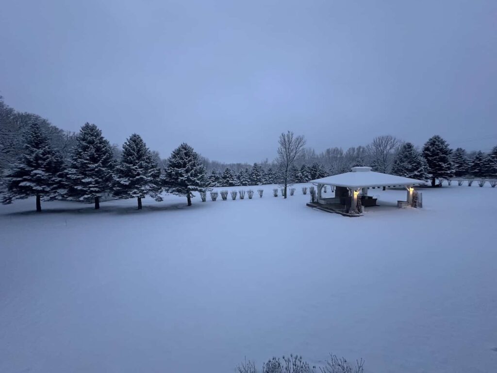 Book the Best Iowa Getaways for Couples at our B&B. Photo of our property covered in a blanket of snow